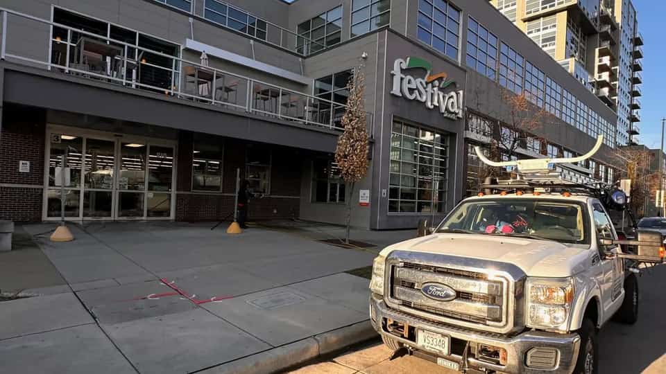 Total Wash Co. truck in front of Festival Foods commercial building