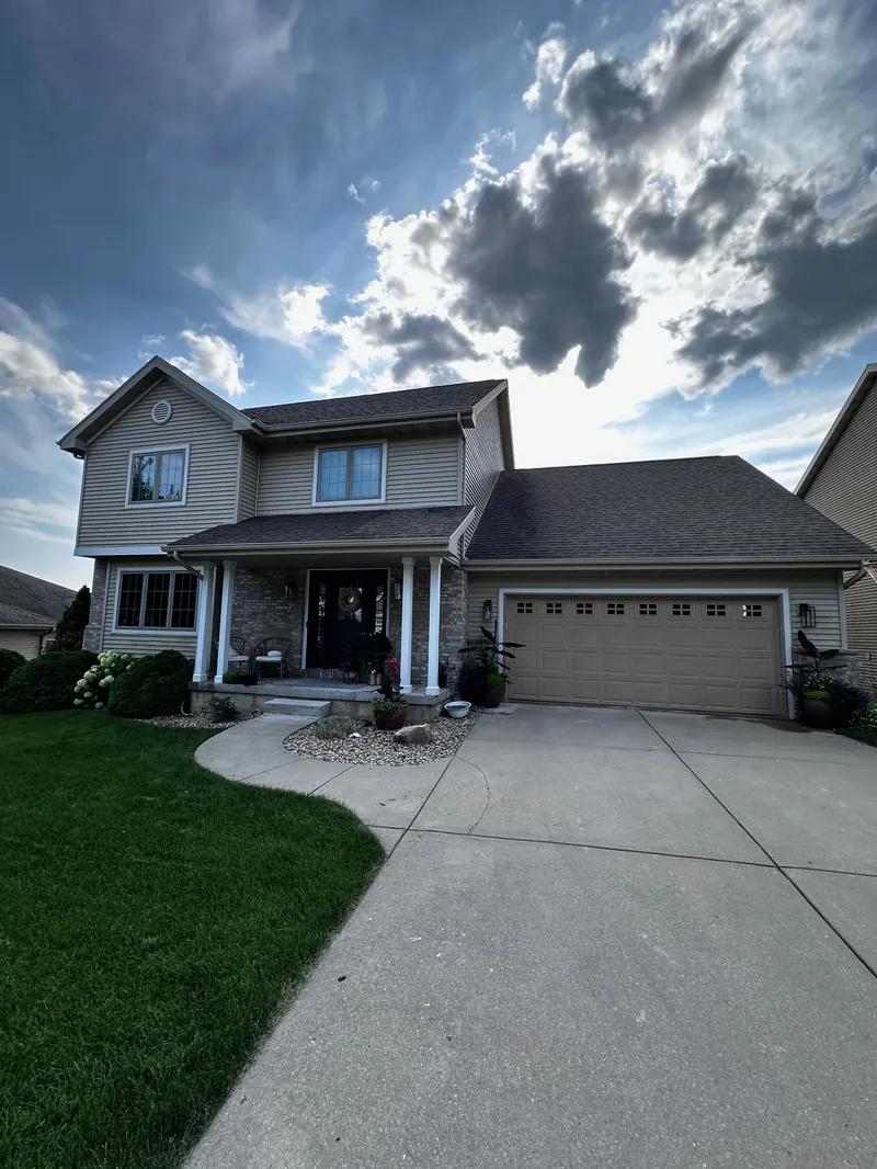A two-story Madison, WI home with freshly soft-washed siding
